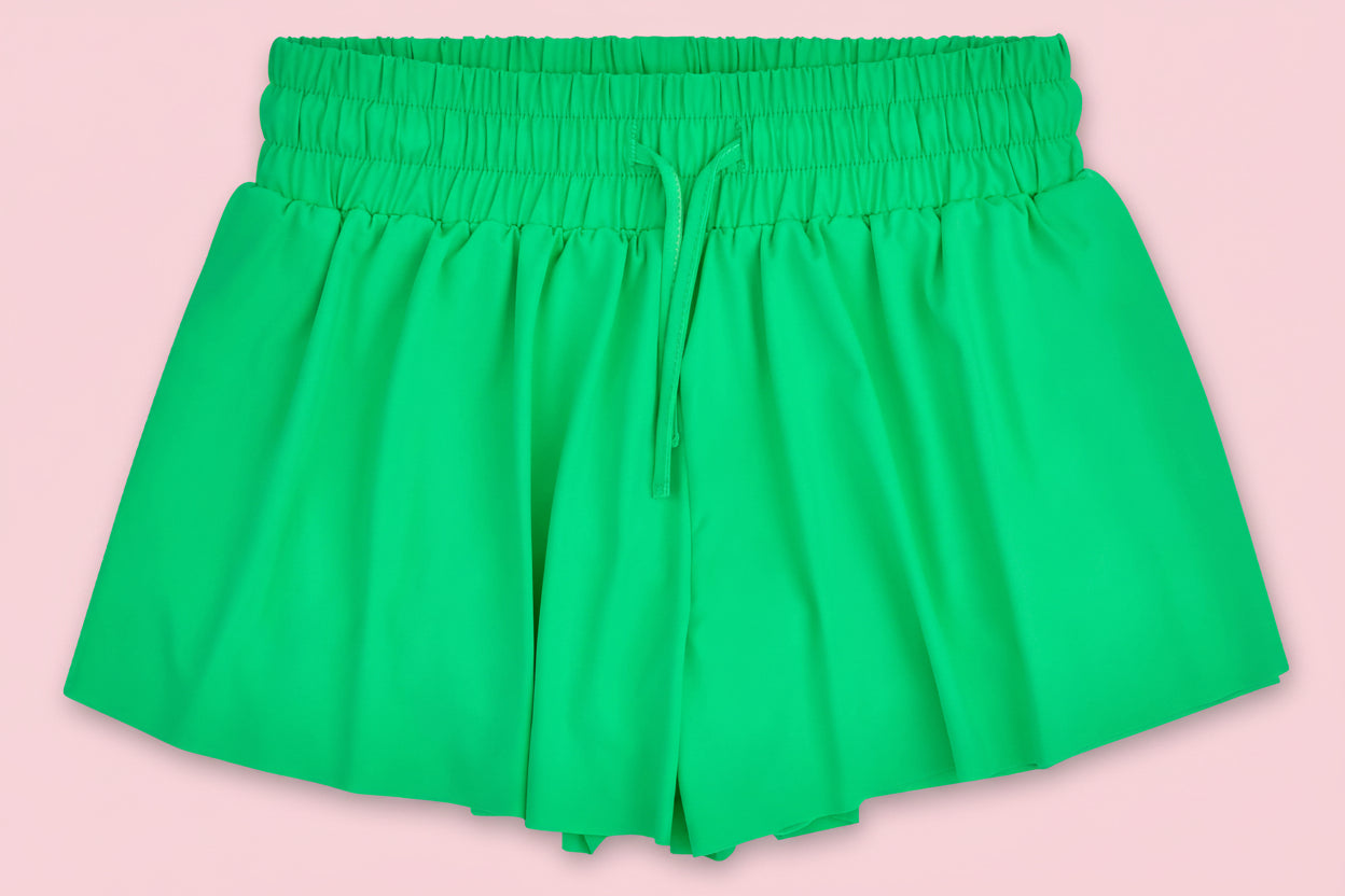 Green shorts on a pink background