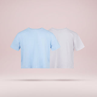 Two crop tops, one light blue and one white, on a pink background