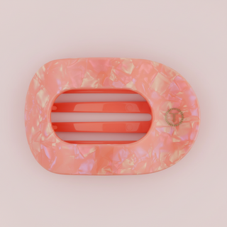 Pink marble hair clip on a pink background