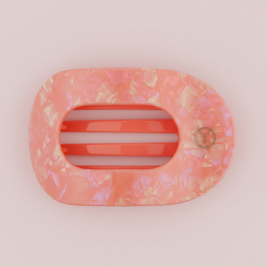 Pink marble hair clip on a pink background
