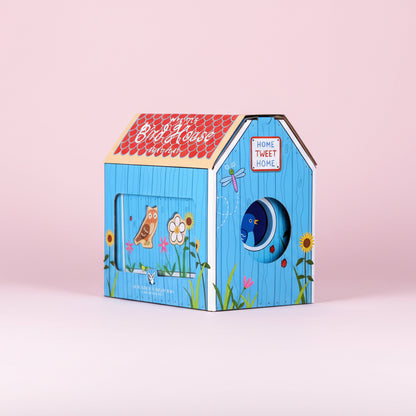 Children's birdhouse with colorful design on a pink background