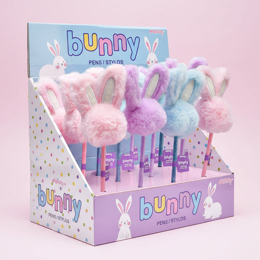 Display box of bunny pens with colorful designs and text on a pink background