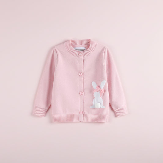Pink cardigan with a bunny design on a pink background