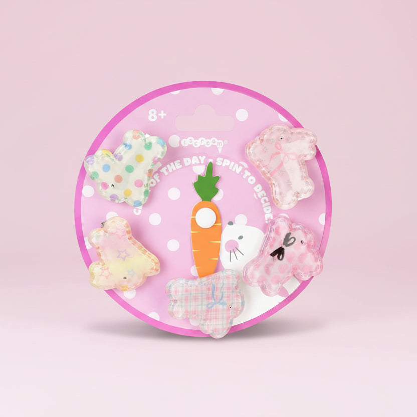 Set of colorful animal-shaped hair clips on a pink circular packaging with a carrot and mouse design.
