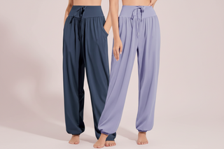 Two pairs of wide-leg pants, one navy and one lavender, on a plain background.