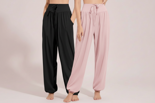Two pairs of wide-leg pants, one black and one pink, on a plain background.