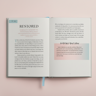 Open book with text on a pink background