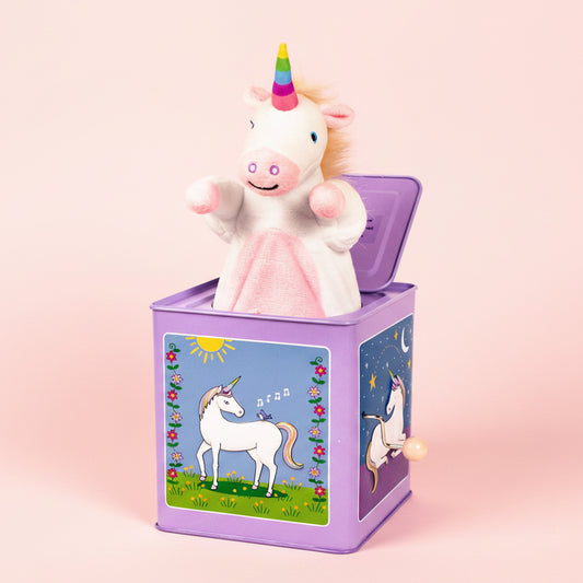 Unicorn-shaped jack-in-the-box toy with a colorful design on the box.
