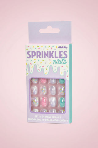 Packaged set of press-on nails with colorful design and 'Sprinkles Nails' branding.