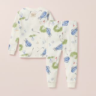 Children's pajama set with golf-themed print on a white background