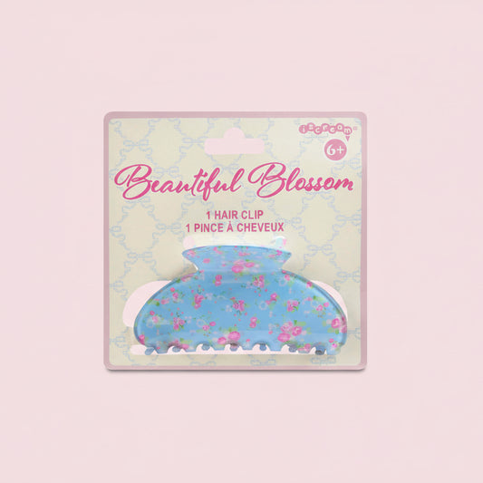 Floral hair clip packaging with 'Beautiful Blossom' text on a patterned background