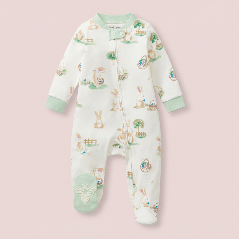 Baby onesie with animal print on a pink background