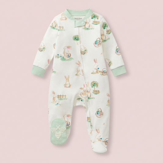 Baby onesie with animal print on a pink background