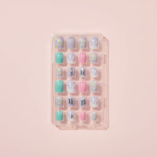 Set of colorful nail art stickers in a white tray
