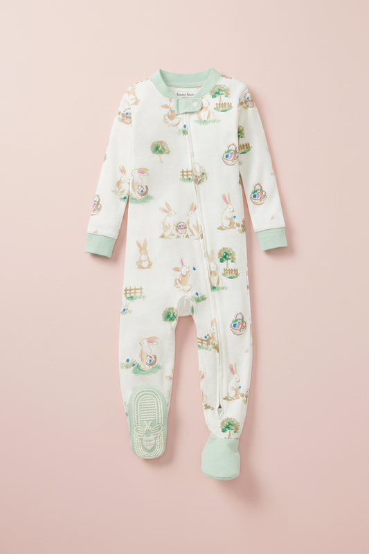 Baby onesie with animal print on a pink background