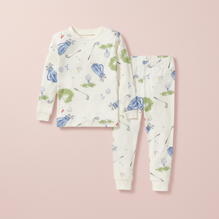 Children's pajama set with golf-themed print on a white background