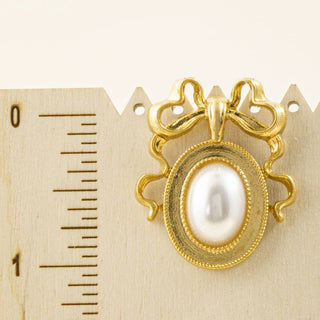Bow Top Oval Pearl Frame Stud Earrings