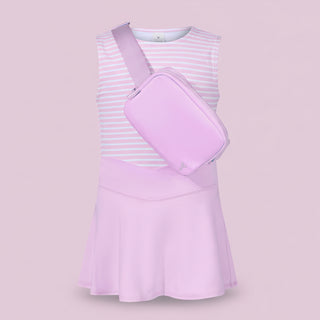 Pink dress with a matching bag on a light pink background