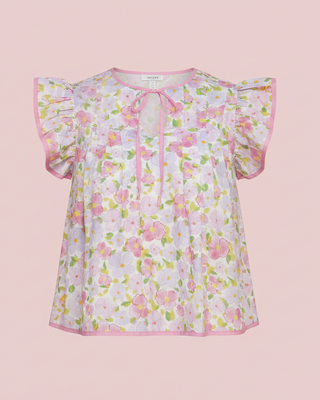 Floral blouse on a pink background